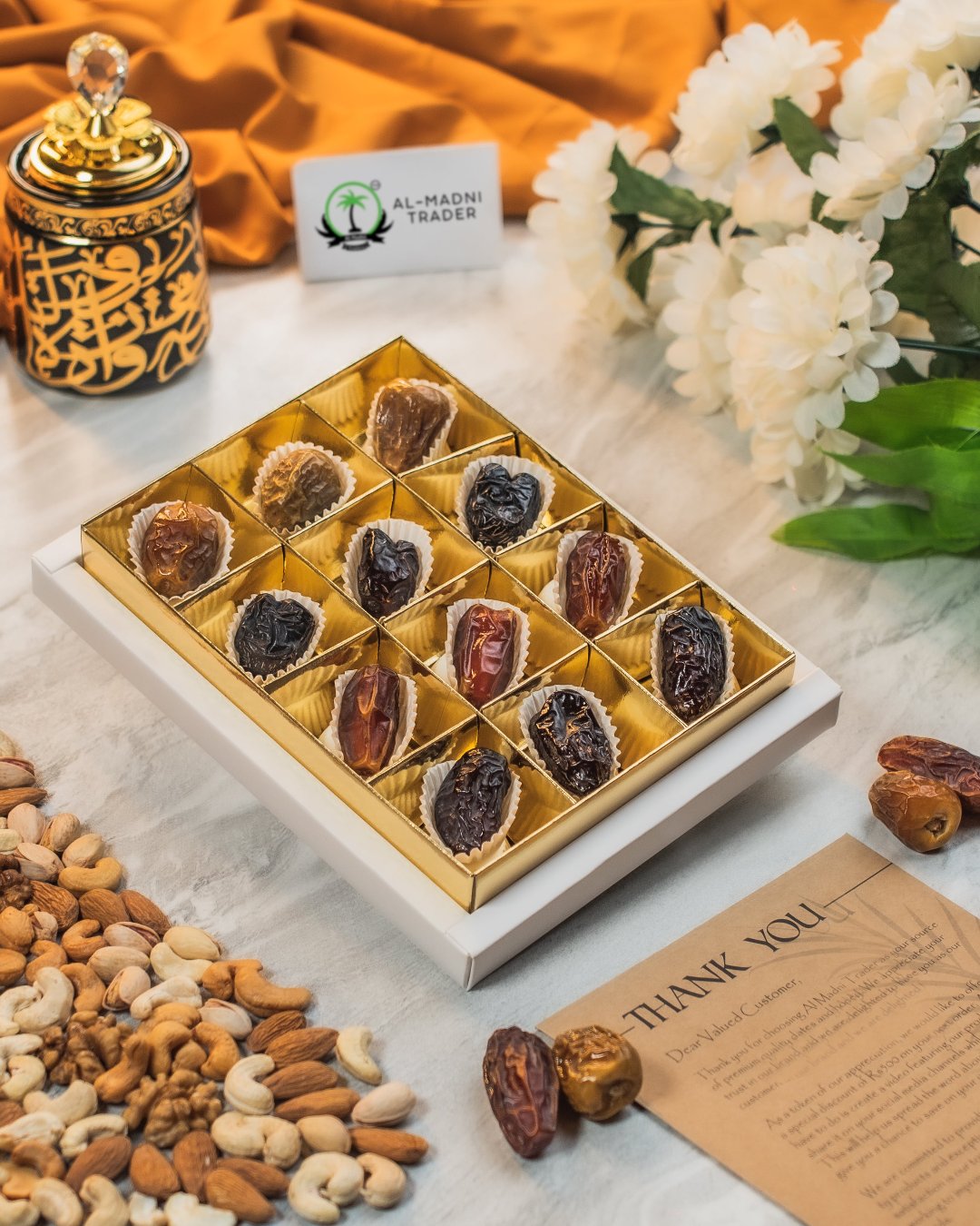 "Al Qasr Gift Basket featuring Mabroom dates, Ajwa dates, Qalmi dates, and Sukkari dates with premium mixed nuts."
