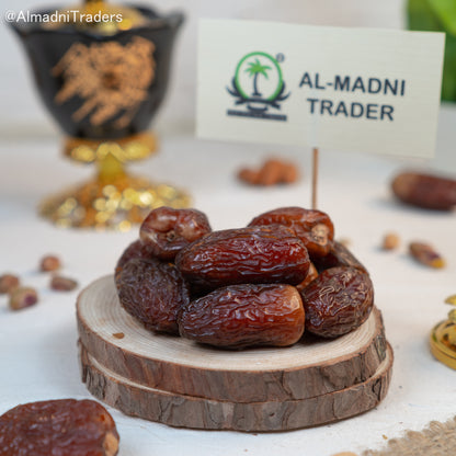 Close-up of Premium Medjool Dates showcasing their plump, glossy appearance and rich brown color