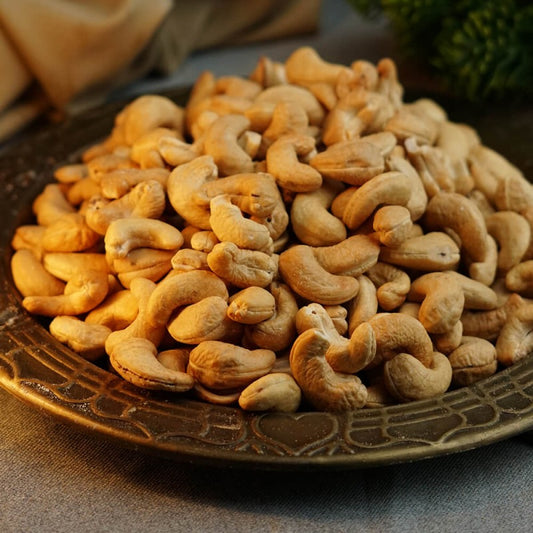 A bowl of golden-brown roasted cashews, ready to eat.