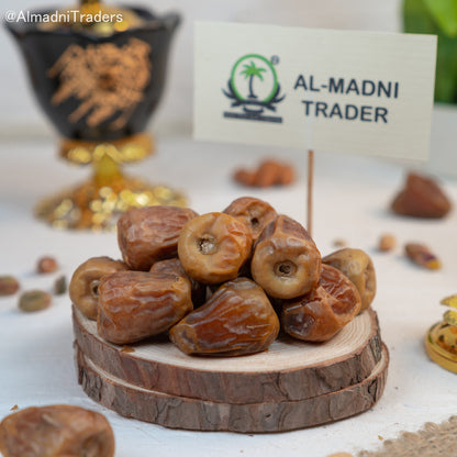 "Close-up of Sukri Dates showcasing their golden-brown color and plump texture"