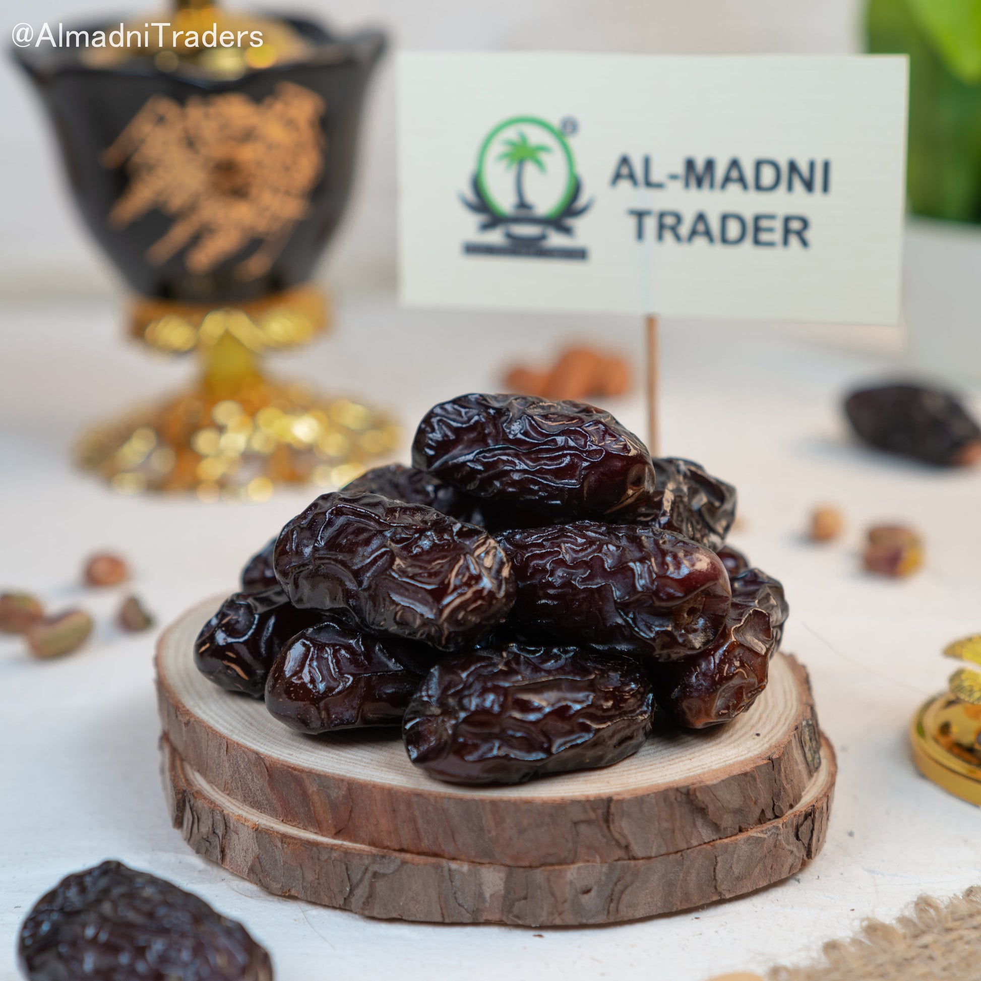 Qalmi Dates arranged on a plate, highlighting their rich, chewy texture